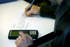 This photo shows someone working with a calculator