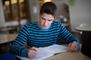 This photo shows a male student studying