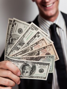 This photo shows a male holding money