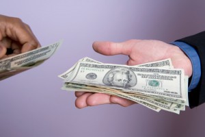 This photo shows a hand with money