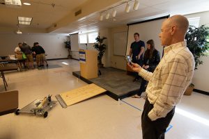 Engineering Technology students running robots through obstacle course