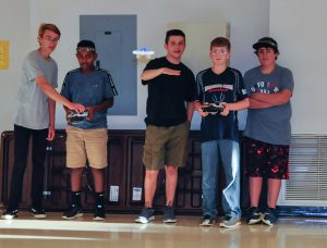 Students from the PA Cyber Charter class take turns flying a drone.
