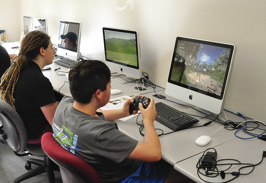 PA Cyber Charter Schools students are shown practicing drone piloting on a computer simulator.