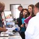 This photo shows students speaking to local employers the the career fair