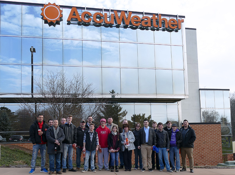 Information Technology students standing outside of AccuWeather in State College