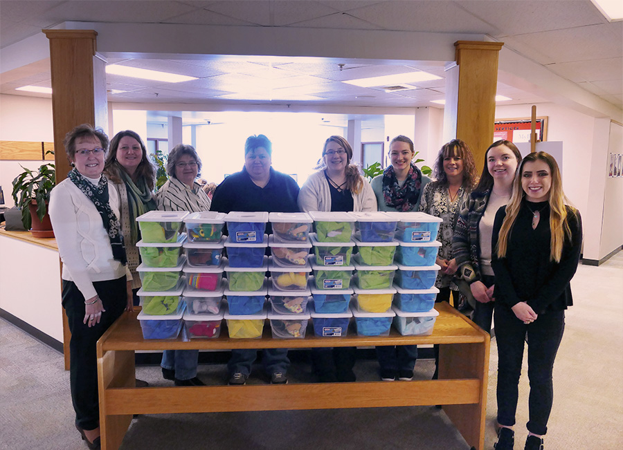 The Health Careers Club and their advisor are pictured with the Jared Boxes they assembled.