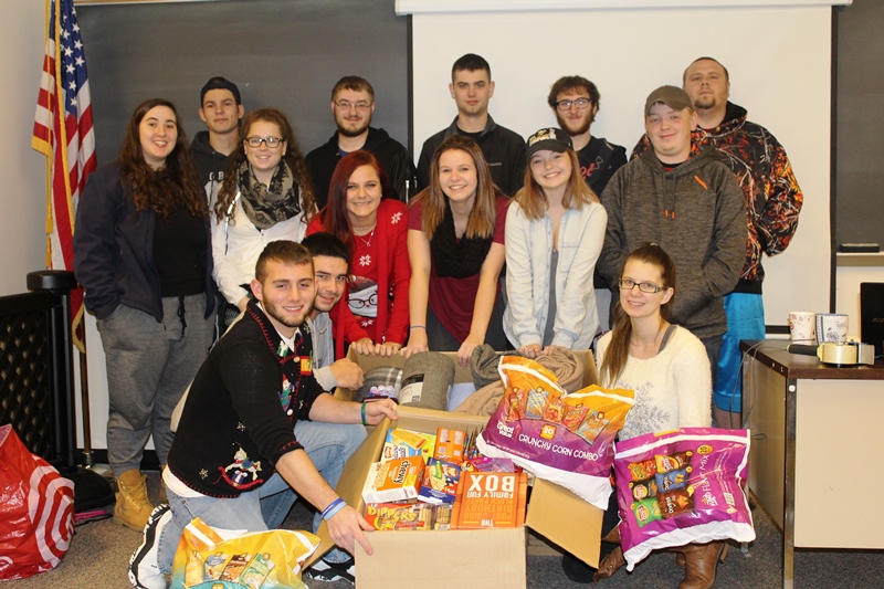 This photo shows a group of students with food donations