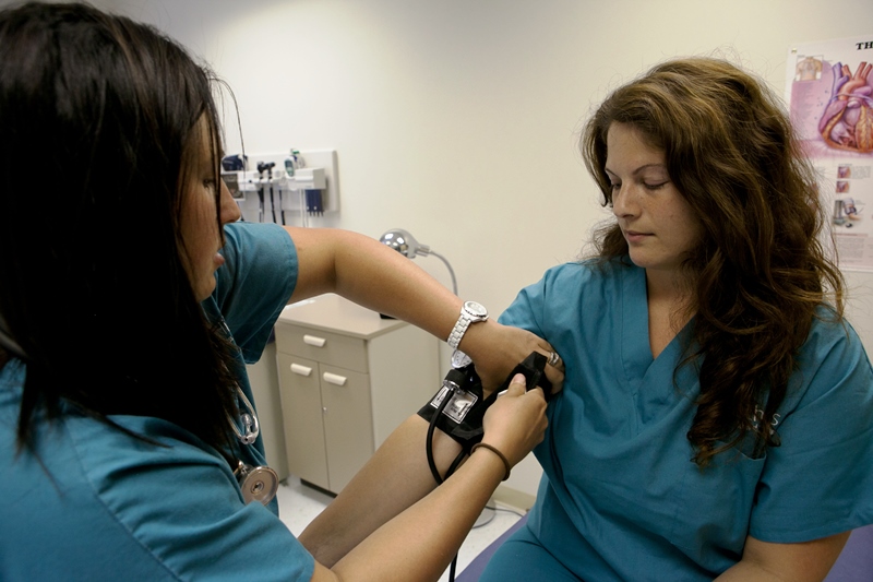 Medical Assistant students practicing taking blood pressure