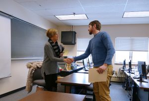 Leanne Condo, Human Resource Manager at Blatek, greets Daniel Vandrew, second-year Engineering Technology student, at the start of his mock job interview.
