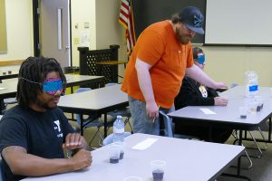 BAMM & IT students participate in a soda taste-test experiment.