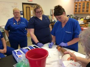 Medical Assistant students practicing in a lab