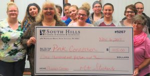Medical Assistant students with donation check