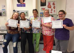Healthcare students earn certificates.